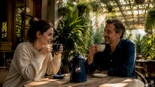 Woman drinking coffee and man drinking tea outdoors